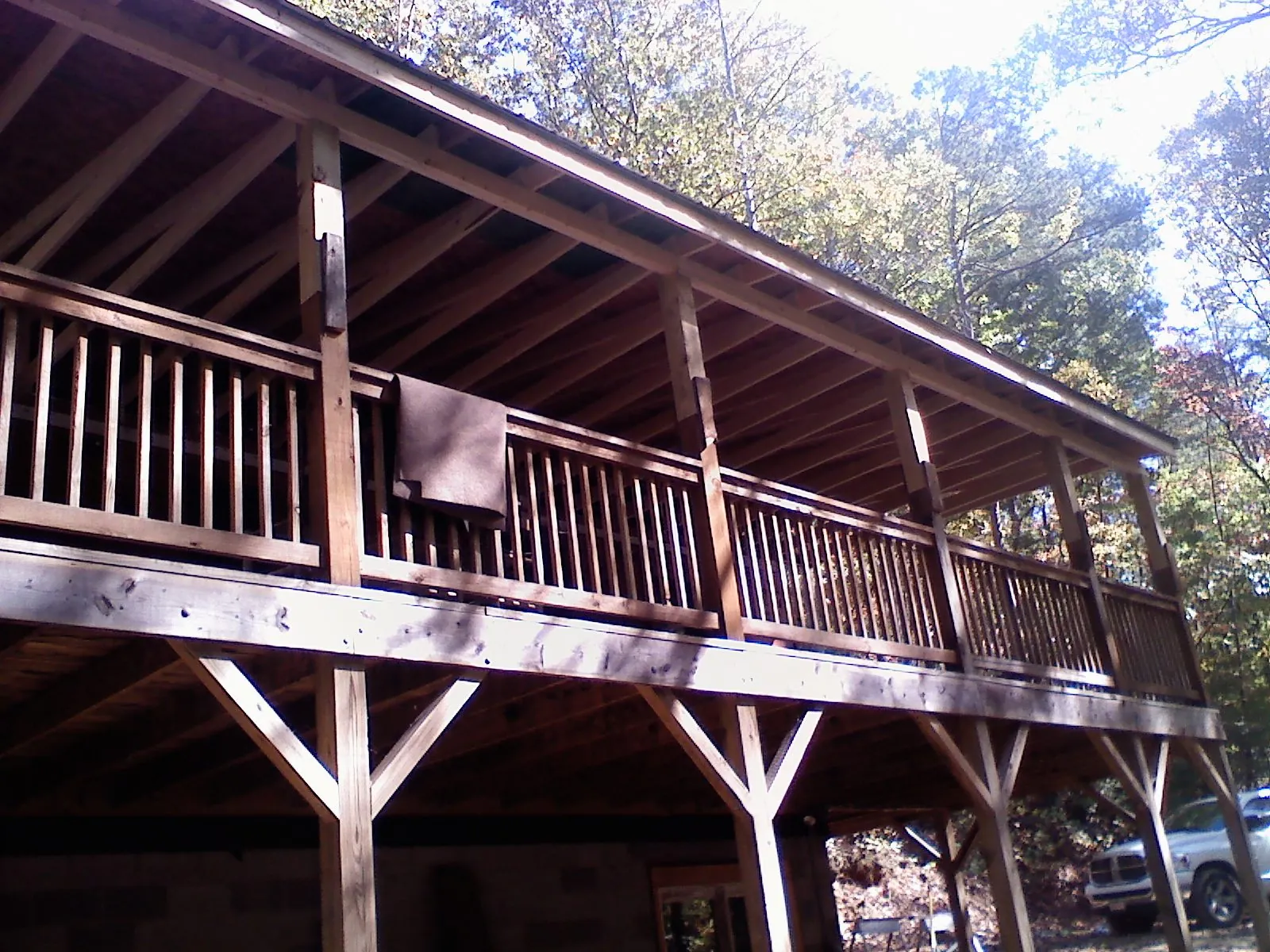 Timber framing under a new elevated porch and deck in Franklin